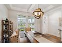 Cozy dining area featuring a modern light fixture and a view of the front yard at 817 James J Freeland Memorial Dr, Hillsborough, NC 27278