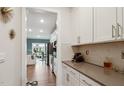 Stylish kitchen with white cabinets, gray countertops, and stainless steel appliances at 817 James J Freeland Memorial Dr, Hillsborough, NC 27278