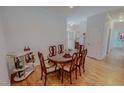 Cozy dining room featuring hardwood floors, wood table with six chairs, and a serving cart at 90 S Old Lantern Rd, Timberlake, NC 27583