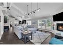 Open living room boasts high ceilings, a fireplace, a large sofa, and stylish decor at 101 Ferndale Ct, Clayton, NC 27520