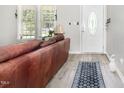 Cozy living room with a decorative door and large window at 11 Sherman Rd, Fuquay Varina, NC 27526