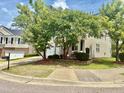 Inviting home featuring a two-car garage and well-maintained landscaping at 1121 Brookhill Way, Cary, NC 27519