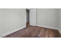 Featuring fresh paint, hard wood floors, base molding, and a door to the left, this room is full of potential at 203 Spring Street St, Louisburg, NC 27549