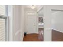 Bright foyer with hardwood floors and white trim at 2323 Pindos Dr, Cary, NC 27519