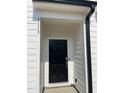 Modern black front door with stylish hardware, set in a white frame at 3113 White Blossom Ct, Raleigh, NC 27610