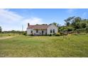 Classic single-story home featuring a well-kept lawn and inviting facade at 4240 Friendship Rock Creek Rd, Burlington, NC 27215