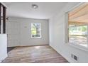 Bright room featuring new light wood flooring, fresh white walls, and abundant natural light at 4412 Green Spring Dr, Garner, NC 27529