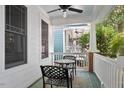 Inviting front porch with outdoor seating and a ceiling fan for a relaxing atmosphere at 10570 Evergreen Spring Pl, Raleigh, NC 27614