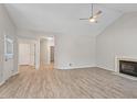 Spacious living room with new flooring, a fireplace, and high ceilings at 108 Ellsworth Pl, Cary, NC 27511