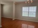 Dining room features hardwood floors, neutral wall color and large window for natural light at 1100 Birkdale Dr, Mebane, NC 27302