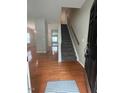 Inviting foyer with hardwood floors and a staircase, creating a warm welcome to the home at 1100 Birkdale Dr, Mebane, NC 27302