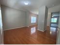 Spacious living room features hardwood flooring, neutral wall colors and lots of natural light at 1100 Birkdale Dr, Mebane, NC 27302