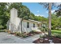 Beautifully landscaped house featuring a neat yard and well-defined walkway at 1104 Suterland Rd, Cary, NC 27511