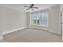 Spacious bedroom featuring plush carpet, large windows and neutral paint color at 117 Finsbury St, Durham, NC 27703