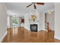 Bright living room boasting hardwood floors and a cozy fireplace, perfect for relaxing at 117 Finsbury St, Durham, NC 27703