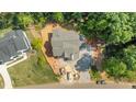 Aerial view of a beautiful home showcasing a spacious lot and private, wooded surroundings at 1529 Lake Adventure Ct, Raleigh, NC 27613
