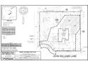 A property plot plan showing the house location, lot dimensions, and surrounding landscape features at 249 John Williams Ln, Pittsboro, NC 27312
