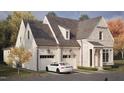 Elegant home featuring a two-car garage, classic exterior lighting, and beautiful architectural details at 2610 Marchmont St, Raleigh, NC 27608
