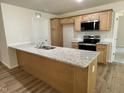 Kitchen with stainless steel appliances, granite countertops, and custom cabinets at 265 Eason Creek Way, Clayton, NC 27527