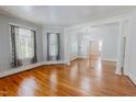 Spacious living room features hardwood floors, high ceilings, and abundant natural light at 29 Oak St, Roxboro, NC 27573