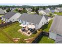 Private backyard with a patio area, perfect for outdoor entertaining and relaxation at 302 Slate Dr, Gibsonville, NC 27249