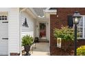 Inviting front porch with decorative details and a welcoming entrance at 302 Slate Dr, Gibsonville, NC 27249