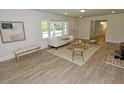 Cozy living room with wood floors, comfortable seating, and natural light at 4414 Nc Hwy 87 N, Pittsboro, NC 27312