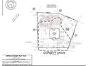 Detailed location plan shows the house position on the lot and its surroundings at 497 Corbett Dr, Pittsboro, NC 27312