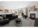Spacious living room with a fireplace, a comfortable couch and backyard access at 6228 Saybrooke Dr, Raleigh, NC 27604