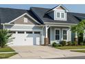 Lovely single-Gathering home with a two-car garage, inviting facade, and manicured front lawn and walkway at 660 Still Willow Ln, Wendell, NC 27591