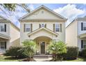 Inviting two-story home with a covered porch, shutters, and lovely landscaping at 808 Historian St, Raleigh, NC 27603
