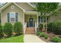 Close-up of the front porch, highlighting the charming details and decorative touches of the home's entrance at 90 Weatherly Dr, Franklinton, NC 27525