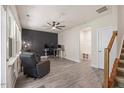 A welcoming living room with hardwood floors, a ceiling fan, and a designated office area at 907 Lake Beacon Way, Raleigh, NC 27606