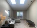Spacious living room with plush seating and plenty of natural light at 929 Morreene Rd # D-34, Durham, NC 27705