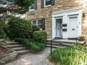 Close up of the front door entrances of this two-story stone home with black shutters at 979 St Marys St # G6, Raleigh, NC 27605
