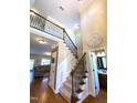 Spacious foyer with hardwood floors, staircase, and a view into the living space at 114 Boone Trl, Garner, NC 27529