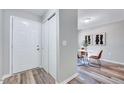 Bright entryway featuring a closet, neutral paint and a dining area with a white table at 1221 Teakwood Pl, Raleigh, NC 27606