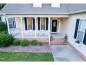 Charming porch with white railing and black shutters offering a warm welcome at 237 Water Front Ln, Timberlake, NC 27583