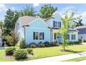 Corner lot showing the home's architectural details and landscaping in a verdant setting at 2635 High Plains Dr, Fuquay Varina, NC 27526