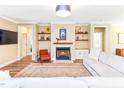 Inviting living room with a cozy fireplace and natural light, perfect for relaxation at 2635 High Plains Dr, Fuquay Varina, NC 27526
