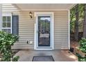 Close-up view of a front door with glass and a house number on the side at 3352 Tarleton W, Durham, NC 27713
