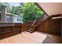 Large wooden deck area with access stairs, providing ample space for outdoor activities and gatherings at 346 Summerwalk Cir, Chapel Hill, NC 27517