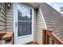 Close-up of front door on second level, offering a welcoming entrance and natural light at 346 Summerwalk Cir, Chapel Hill, NC 27517
