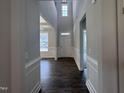 Bright foyer with soaring ceilings, wood floors, and white trim welcomes you into this beautifully designed home at 3509 Bailey Lake Dr, Fuquay Varina, NC 27526