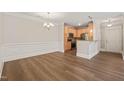 Open dining area with view of the kitchen featuring stainless steel appliances at 501 Finsbury St # 204, Durham, NC 27703