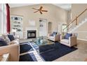 Bright living room with high ceilings, fireplace, and built-in shelving, creating a cozy and inviting atmosphere at 5107 Granbury Dr, Durham, NC 27713