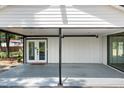 Covered carport area with access to the home's entrance and ample parking space at 6005 Lake Wheeler Rd, Raleigh, NC 27603