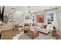 Tastefully decorated living room features a fireplace, hardwood floors, and abundant natural light at 610 Callan View Ave, Wake Forest, NC 27587