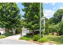 Charming two-story home featuring a well-manicured lawn, inviting curb appeal, and an attached two-car garage at 822 Blue Lake Dr, Mebane, NC 27302