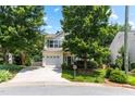 Charming two-story home featuring a well-manicured lawn, inviting curb appeal, and an attached two-car garage at 822 Blue Lake Dr, Mebane, NC 27302